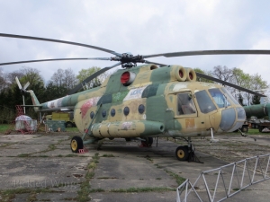 A Mil Mi-8 transport helicopter; faded but firm.